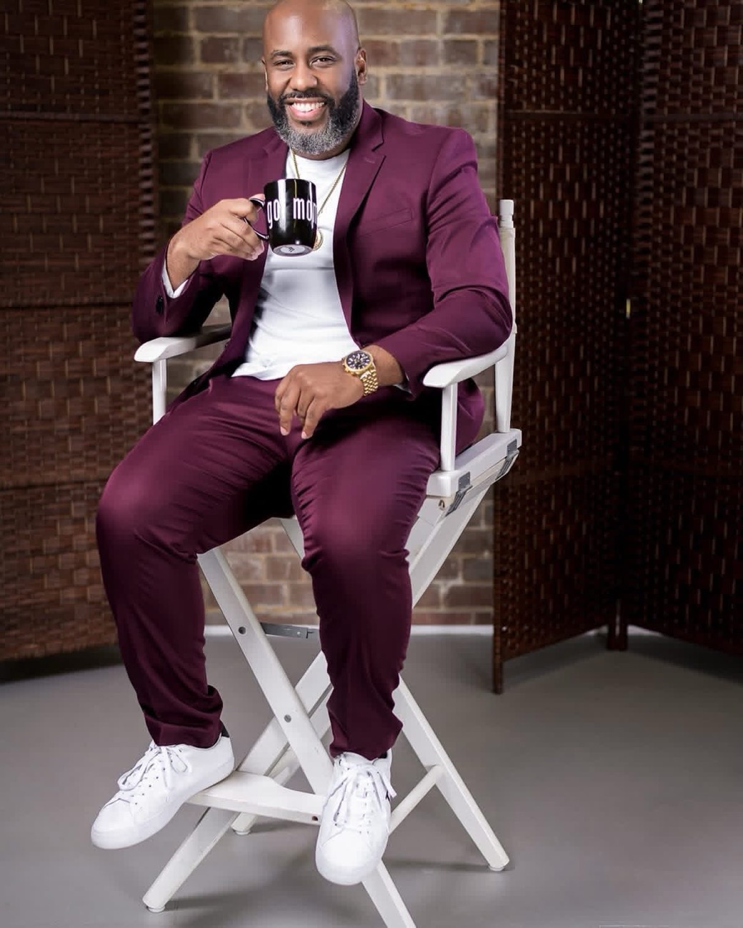 Derrick L. Mercer Jr. in a burgundy suit